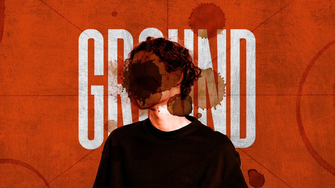 A blurry figure on an orange background